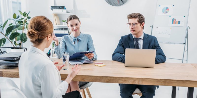 back-view-of-employee-talking-with-recruiters-on-job-interview-in-office.jpg
